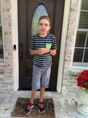 diapers / Sanfilippo Syndrome News / Will stands by his front door and smiles on his first day of middle school.