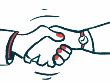 Two people shake hands.